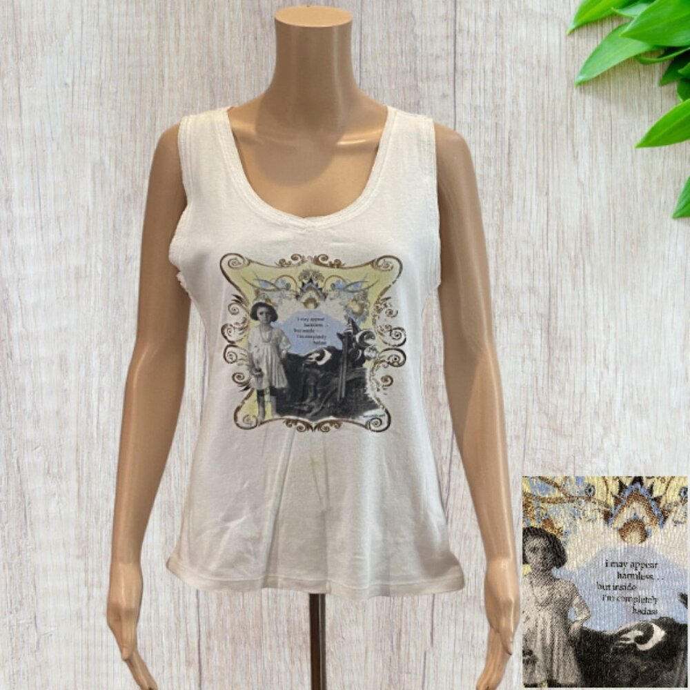 KAVIO! -- White "T" w/Image:  "I May Appear Harmless..But I'm Completely Badass"